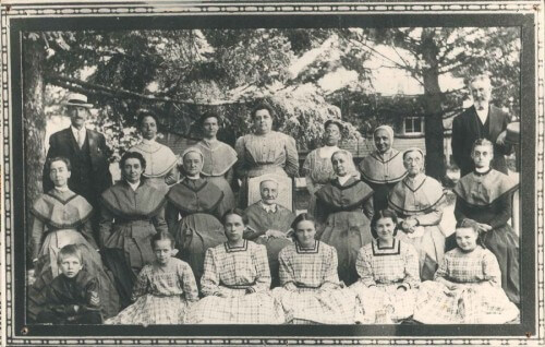 A photo of the South Family c. 1920. Anna Goepper is in the back row, fourth from the left.